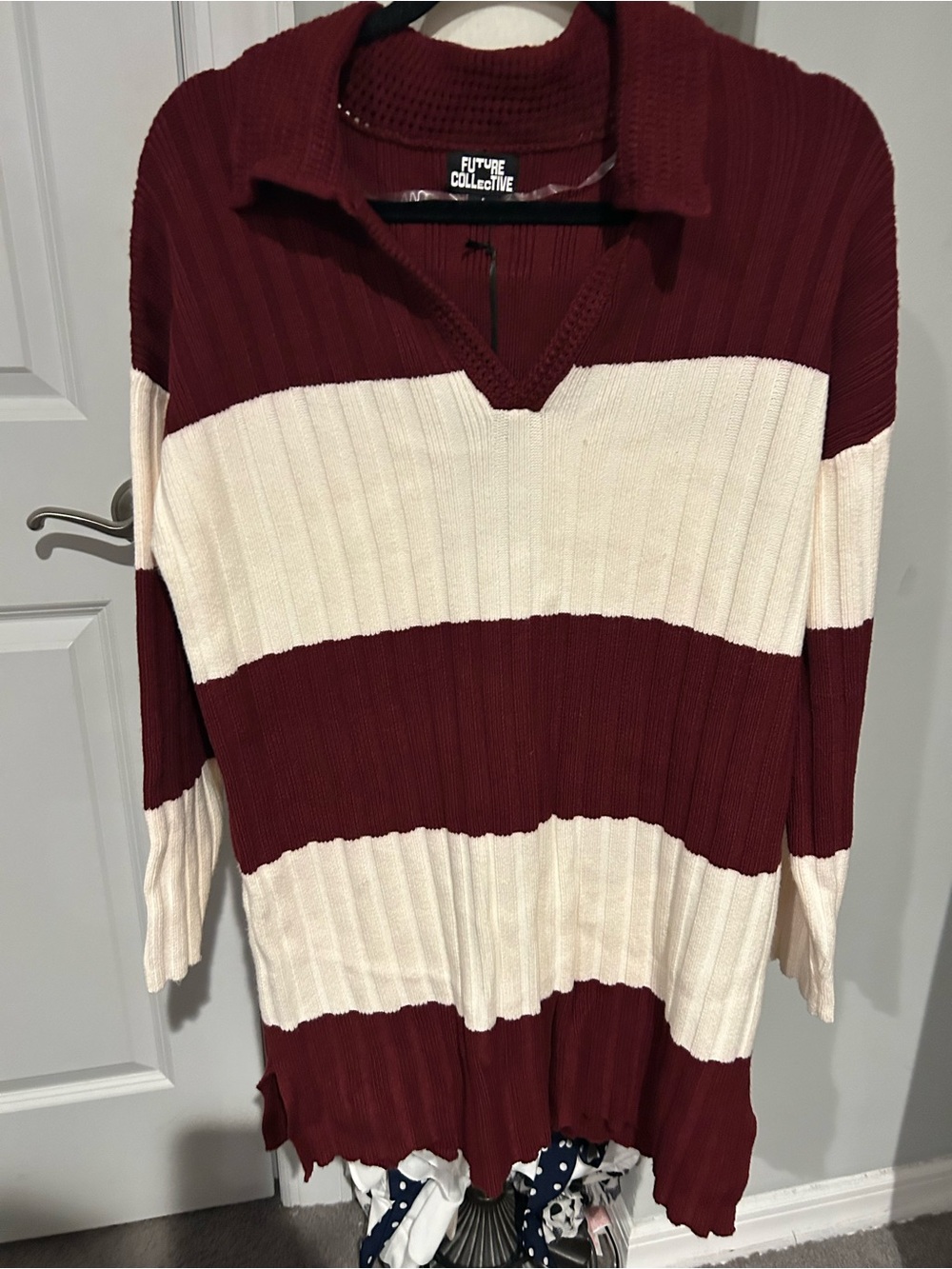 Women's Maroon and Cream Striped V-Neck Sweater Dress.